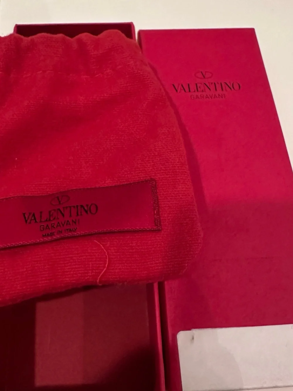 Valentino Garavani Rockstud Key chain Strap in Red with Gold Studs.